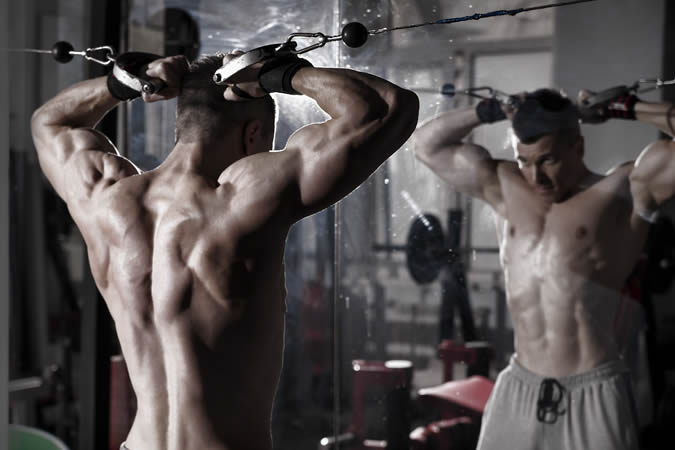 Man exercising on a cable machine